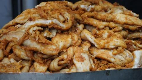 Crispy fried fish fillets piled with golden texture Stock Photos