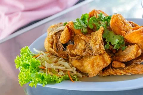 Crispy Fried Fish with Fresh Herbs Stockfoto's
