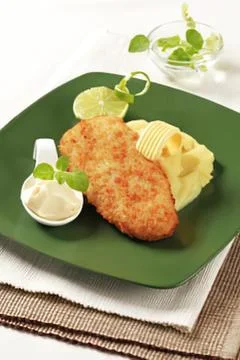 Crispy fried fish with mashed potatoes and sauce Stock Photos