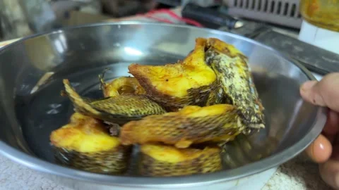 Crispy Fried Fish on Metal Plate Stock Footage 325386736