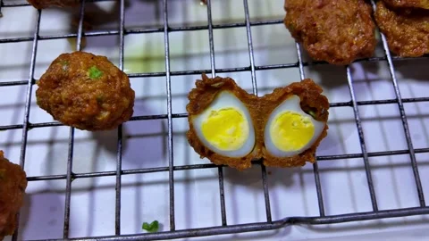 Crispy Fried Meatball Cut Open with Egg Inside Street Food Snack Thailand 4K Stock Footage 333981666