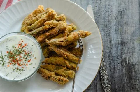 The crispy fried okra in container and spicy yogurt sauce Stock Photos