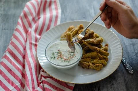 The crispy fried okra in container and spicy yogurt sauce Stock Photos