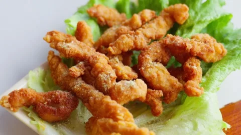 Crispy Fried Pork Strips on Lettuce Garnish — Traditional Chinese Dish Stock Footage 312583575