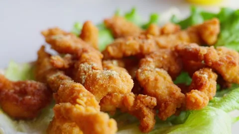 Crispy Fried Pork Strips on Lettuce Garnish — Traditional Chinese Dish Stock Footage 312583581