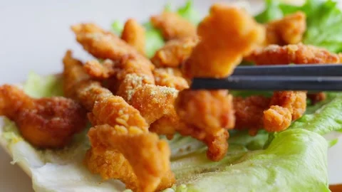 Crispy Fried Pork Strips on Lettuce Garnish — Traditional Chinese Dish Stock Footage 312583590