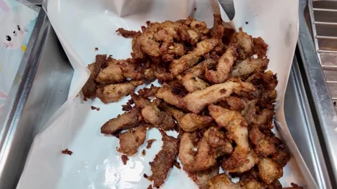 Crispy Fried Pork Strips Served at Thai Street Food Market Stock Footage 335580864