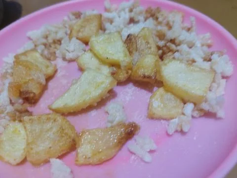 Crispy fried rice snack served with french fries Fotos de archivo