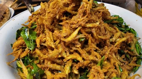 Crispy Fried Small Fish with Curry Leaves in Large Bowl Stock Footage 329369942