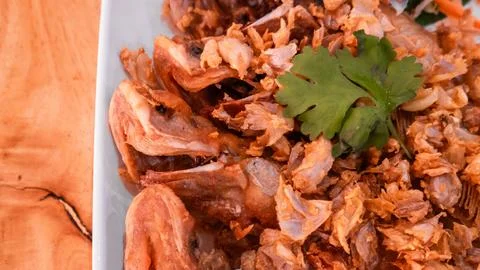 Crispy Fried Soft Fish with Golden Garlic Flakes..Description: Stock Photos
