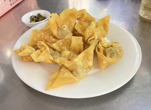 Crispy fried wontons filled with minced pork Stock Photos