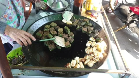 Crispy Garlic Chive Dumplings Being Cooked in a Frying Pan Stock Footage 153378567