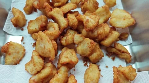 Crispy golden brown fried fish fillets on paper towels. Stock Footage 342740118