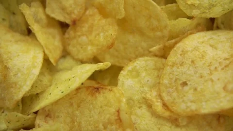 Crispy golden potato chips with herbs and salty seasoning Stock Footage 333835519