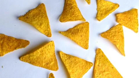 Crispy Golden Triangle Corn Chips Close Up Snack Texture Background 스톡 사진