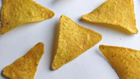 Crispy Golden Triangle Corn Chips Close Up Snack Texture Background Stock Photos