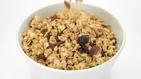 Crispy Granola Cereals Falling Down in bowl Video stock 234614910