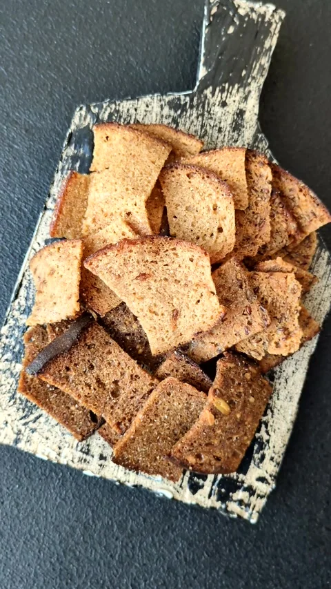 Crispy homemade brown bread chips with seeds and grains Video stock 302826748