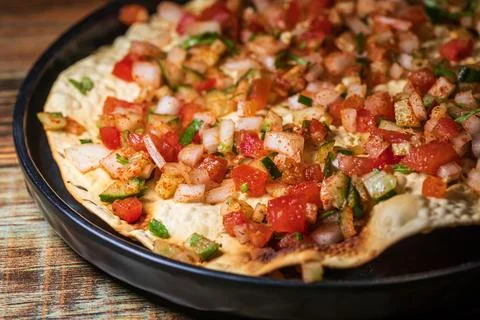 Crispy Indian flatbread with refreshing chopped vegetables Stock Photos