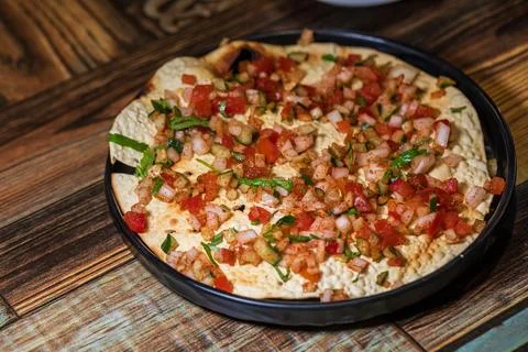 Crispy Indian flatbread with refreshing chopped vegetables Stock Photos