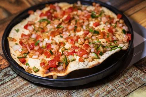 Crispy Indian flatbread with refreshing chopped vegetables Stock Photos