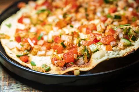 Crispy Indian flatbread with refreshing chopped vegetables Stock Photos