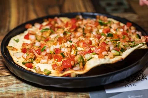 Crispy Indian flatbread with refreshing chopped vegetables 스톡 사진