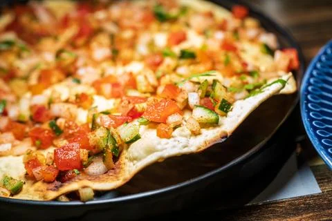 Crispy Indian flatbread with refreshing chopped vegetables Stock Photos