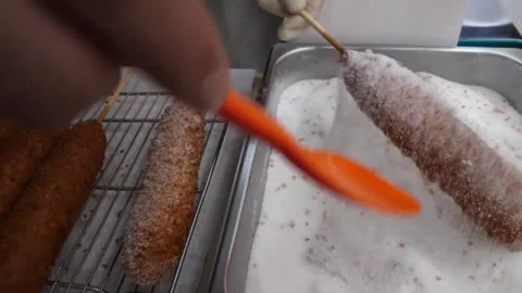 Crispy Korean Corn Dog Being Coated in White Sugar, Popular Asian Street Food Co 스톡 동영상 343587740