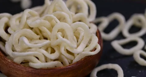 Crispy onion made from onion puree and flour fried in a large amount of Stock Footage 327633525