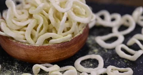Crispy onion rings made from puree and flour fried in a large amount of Stock Footage 327051604