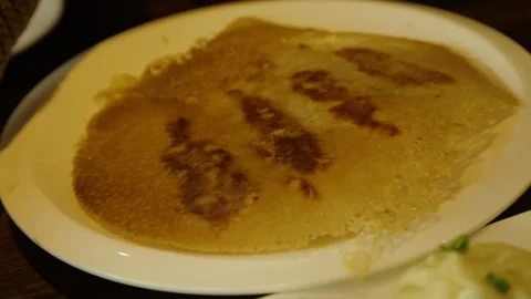 Crispy Pan-Fried Dish on Plate in Beijing Restaurant, China Close-Up Stock Footage 345744829
