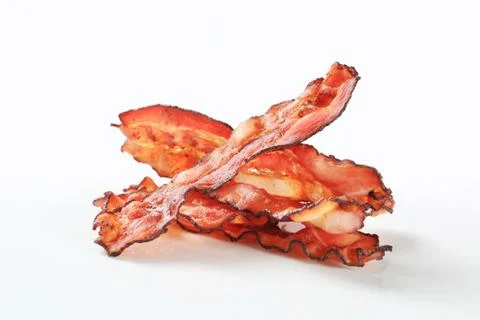 Crispy pan-fried strips of bacon Stock Photos