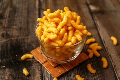 Crispy peanut puffs or flips snacks Stock Photos