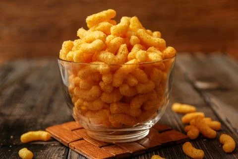 Crispy peanut puffs or flips snacks Stock Photos