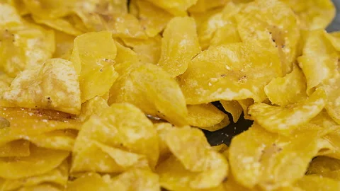 Crispy Peruvian chifles fried plantain chips in a bowl. Stock Footage 339078712