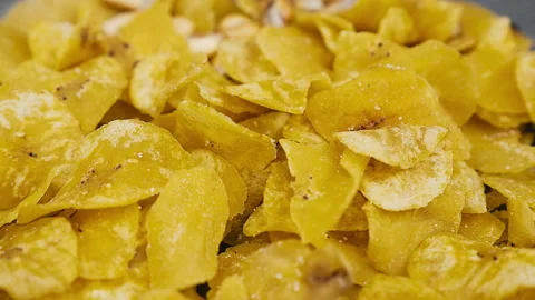 Crispy Peruvian chifles fried plantain chips in a bowl. Video stock 339078714