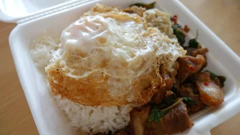 Crispy Pork Basil with Fried Egg Box Takeaway. Stock Footage 315428640
