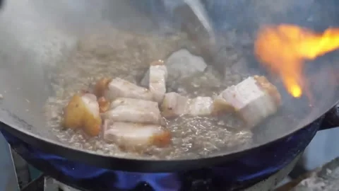 Crispy Pork Belly (Sio Bak) Deep Frying in Hot Oil in a Traditional Wok Video stock 338211855
