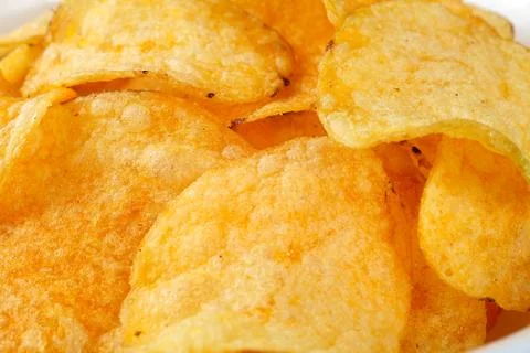 Crispy potato chips, background, close-up Stock Photos