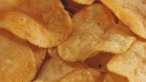 Crispy potato chips with cheddar cheese, rotating close up, macro Stock Footage 228922763