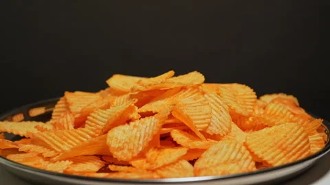 Crispy potato chips. Golden fried potatoes snack for unhealthy fast food. S.. Stock Footage 325635115