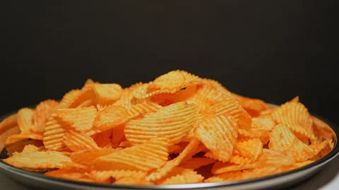 Crispy potato chips. Golden fried potatoes snack for unhealthy fast food. S.. Stock Footage 325635116