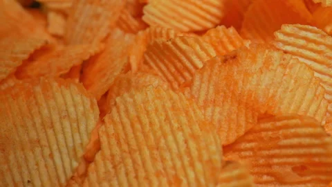 Crispy potato chips. Golden fried potatoes snack for unhealthy fast food. S.. 動画素材 325635117