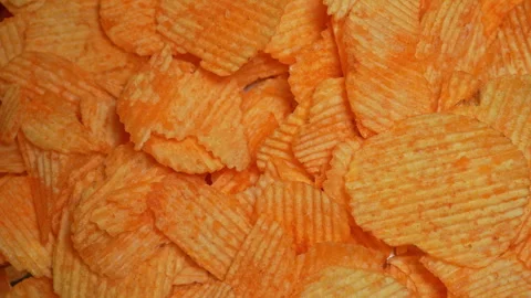 Crispy potato chips. Golden fried potatoes snack for unhealthy fast food. S.. 動画素材 325635141