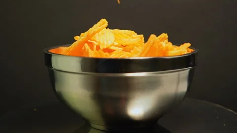 Crispy potato chips. Golden fried potatoes snack for unhealthy fast food. S.. Stock Footage 325635272