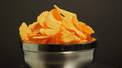 Crispy potato chips. Golden fried potatoes snack for unhealthy fast food. S.. Stock Footage 325635281