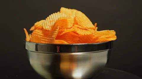 Crispy potato chips. Golden fried potatoes snack for unhealthy fast food. S.. Stock Footage 325635304