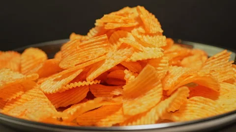 Crispy potato chips. Golden fried potatoes snack for unhealthy fast food. S.. Stock Footage 325635316