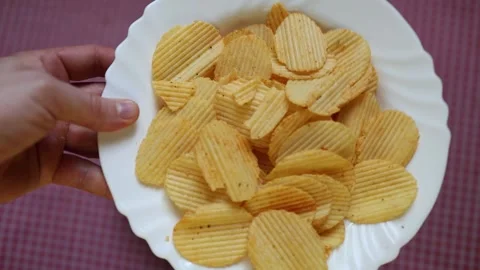Crispy potato chips ready for a salty snack anytime Stock Footage 340221503